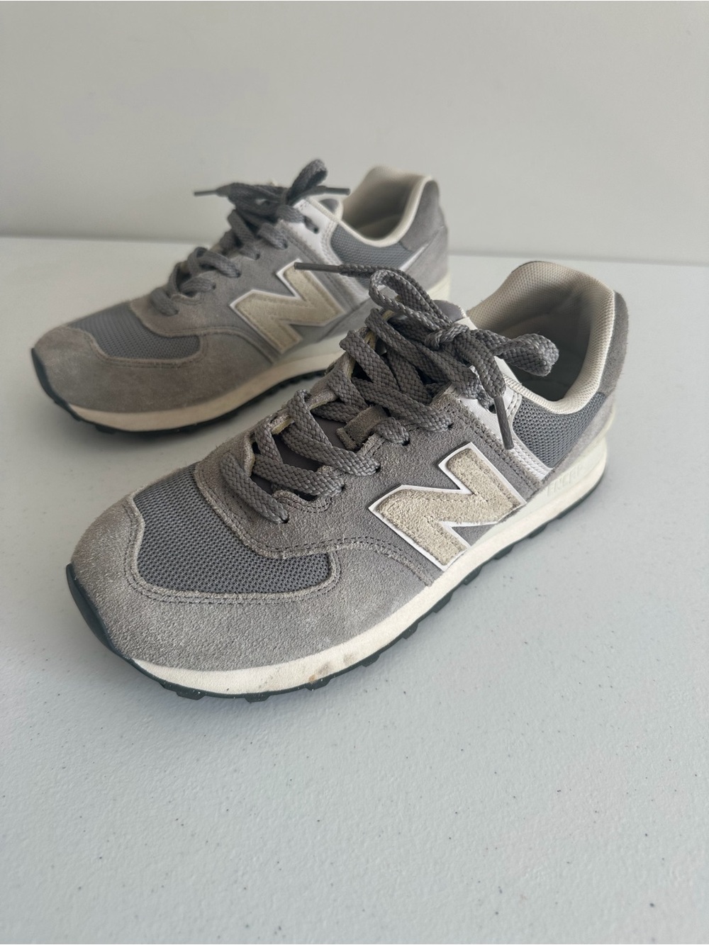 Men’s 7.5 New Balance 574 Gray and White Sneakers